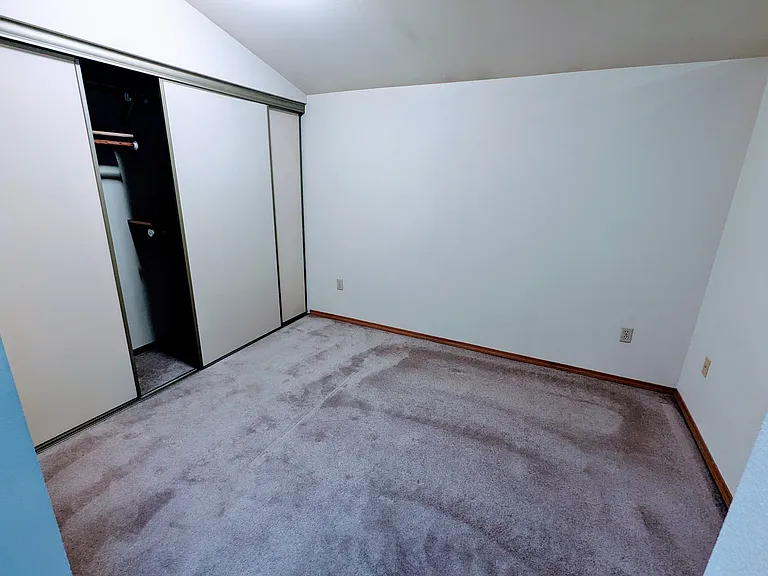Enormous bedroom closets 8 feet wide and 8 feet tall. So much storage!
