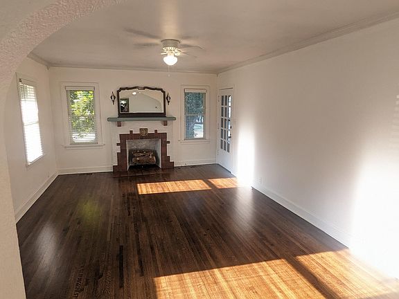 living room. sconces are functional. newly refinished floors througout.