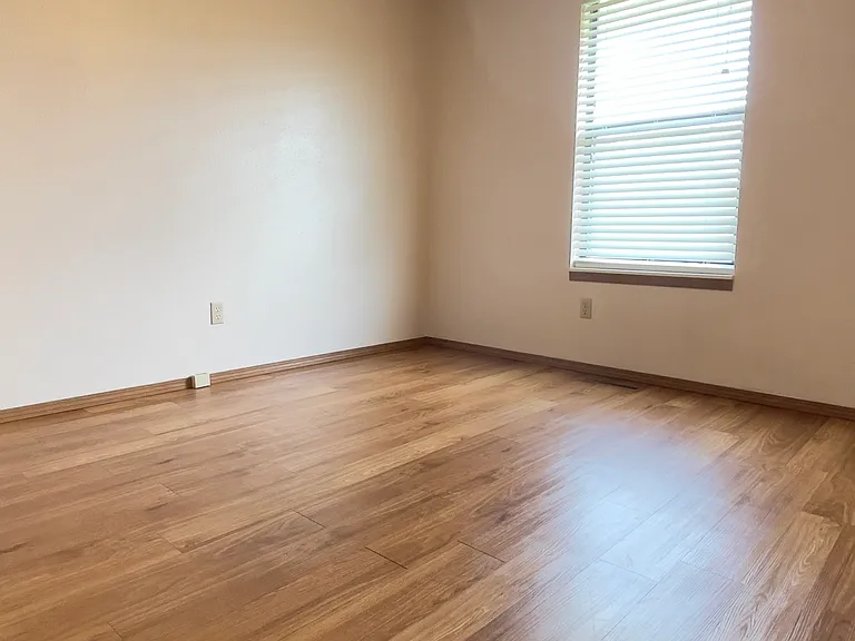 This 1st Bedroom is located at the very end of the hallway.