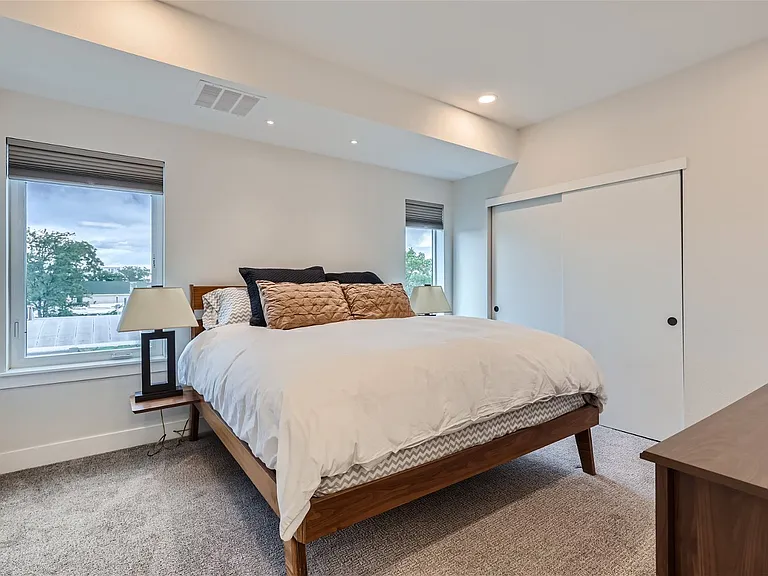 Primary bedroom with king size bed and north facing light
