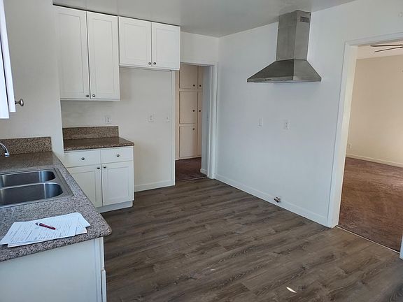 Kitchen where stove and refrigerator go. No appliances included