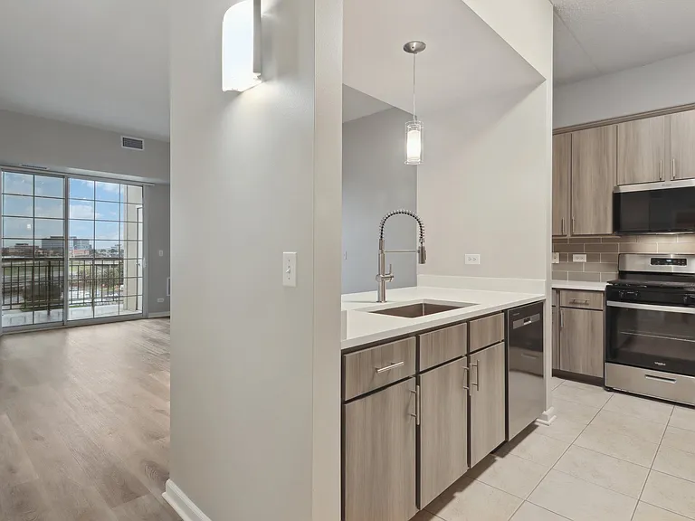 Modern kitchen with sleek countertops and lighting