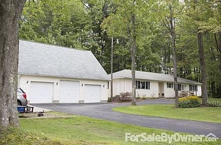Front View of House & Garage
						:
						Front view of the house from 6N.
