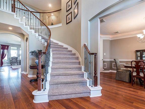 Upon entering this home, you step into the open foyer and adjoining dining room with beautiful laminate wood floors.