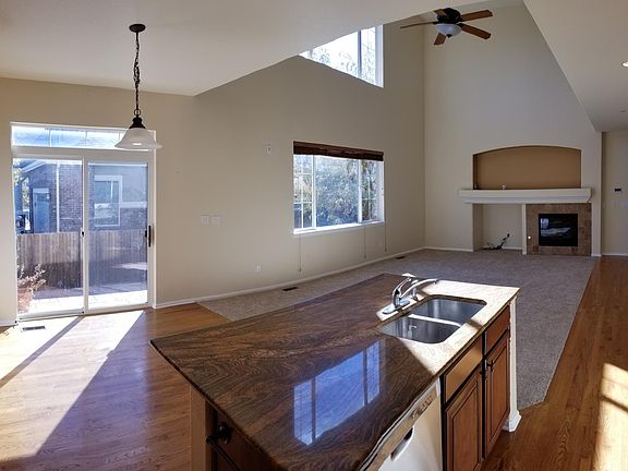 Family room with fireplace, lots of light and 2 story ceilings