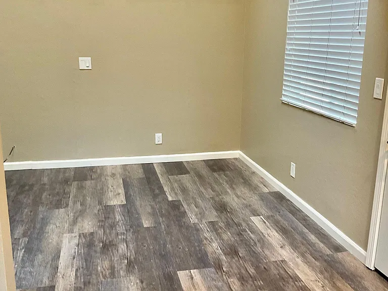 Living room with vaulted ceilings and new laminate floors