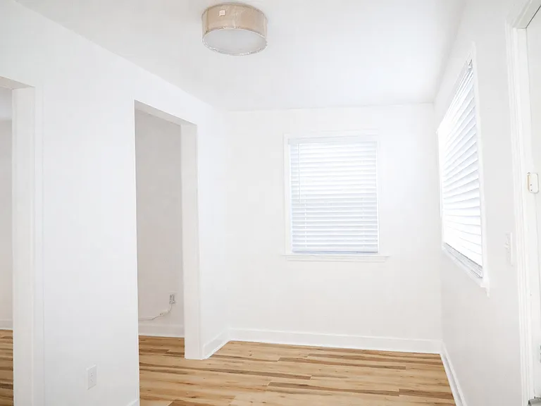 Front room ideal for a dedicated office, lounge, or flexible living space