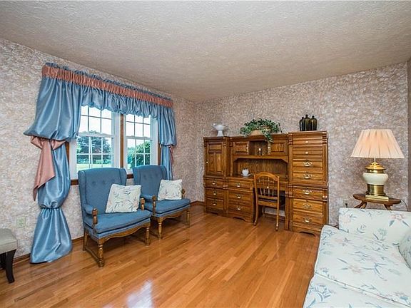 The dining room overlooks the front of the home.  Gleaming wood floors are found in the living room and throughout most of the m