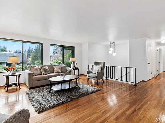 Hardwood floors throughout the upper level of this bright and roomy Northwest split-level home.