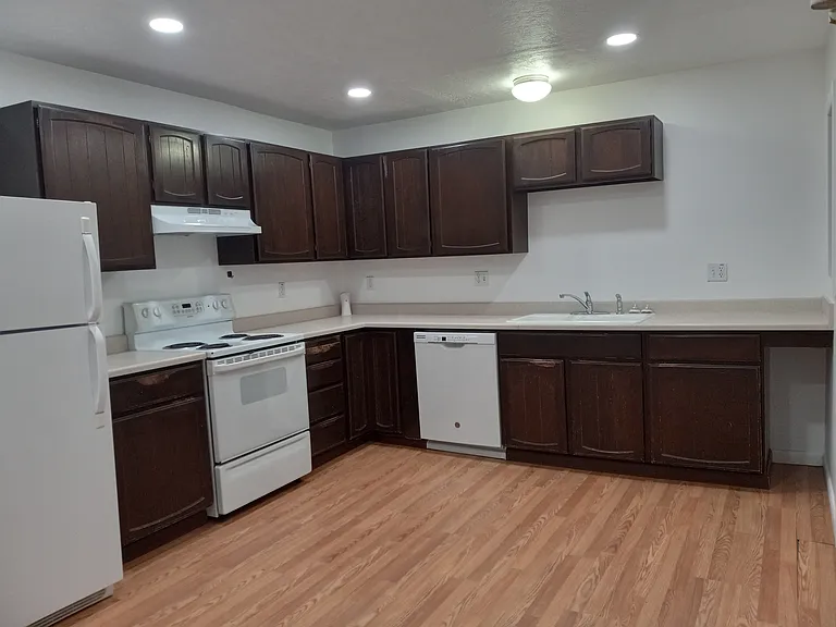 Full kitchen with ample storage space & food prep area