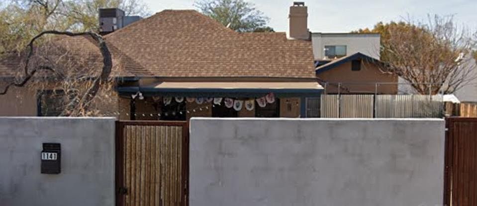 Front pedestrian entryway (left) and double gate to driveway (right)