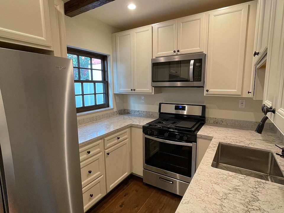 New kitchen withquartz countertops and stainless appliances