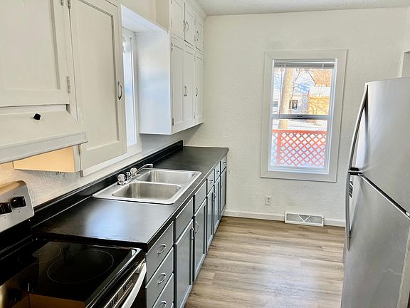 Modern glass top stove, stainless steel fridge
