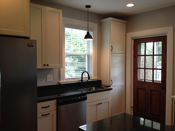 Kitchen with stainless steel appliances, plenty of storage a