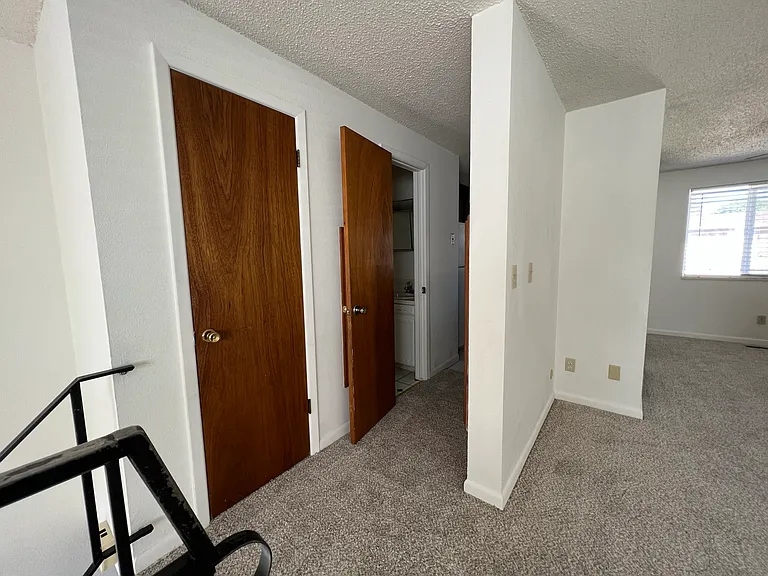 hall closet, half-bath, and kitchen