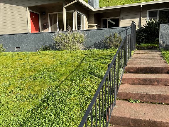 Solar lights for steps at night. Gate at top leads to entryway to the three units.