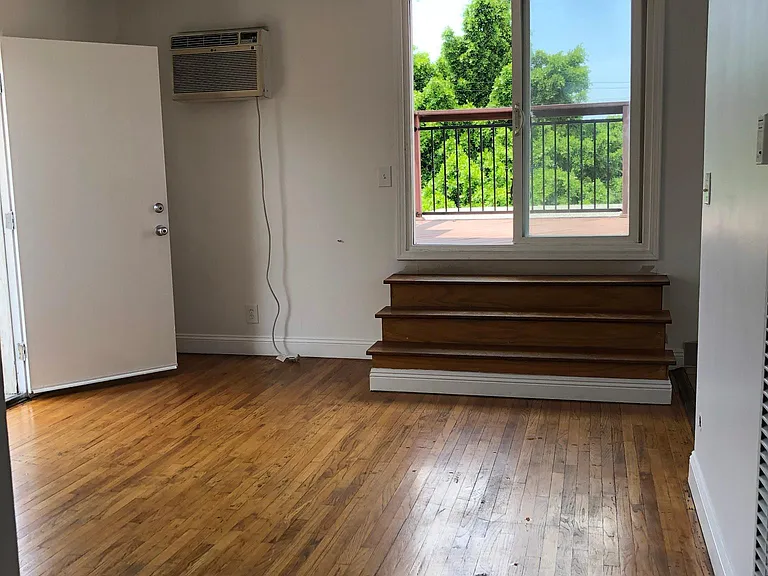 A/C in Living room. Original wood floors throughout.