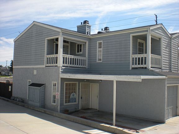 This townhome has a front carport along with attached garage.