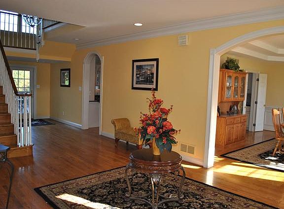 Enter into this formal back to front foyer.