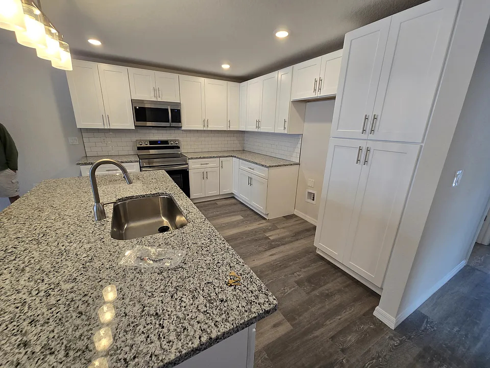 Kitchen with Brand New Stainless Appliances (fridge included - see other photos), brand new cabinets, and granite counters.