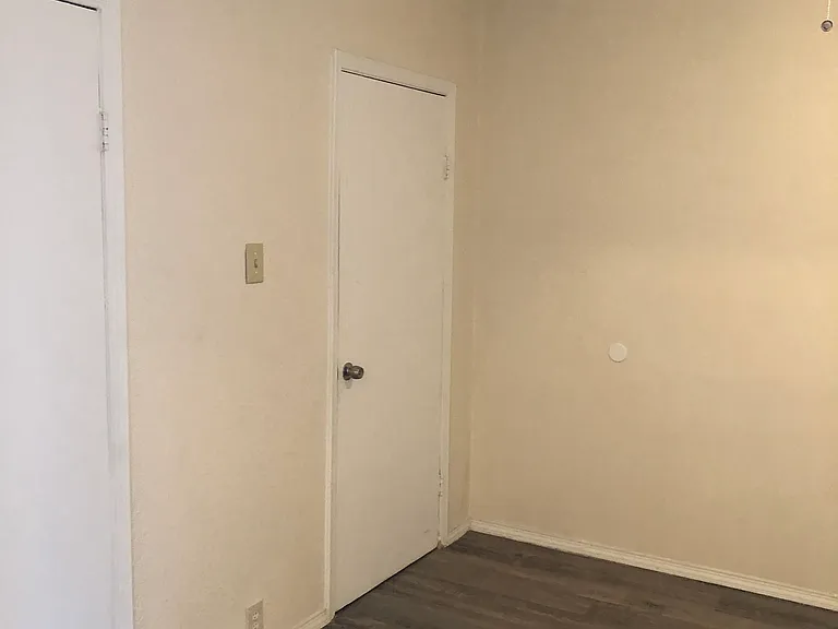 Bedroom space form another angle. Door in the background is to the bathroom.