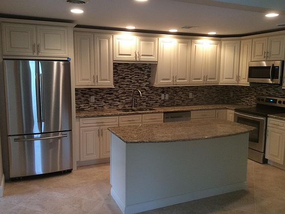 CUSTOM CABINETRY WITH SOFT CLOSE DOORS, NEW S/S APPLIANCES,B