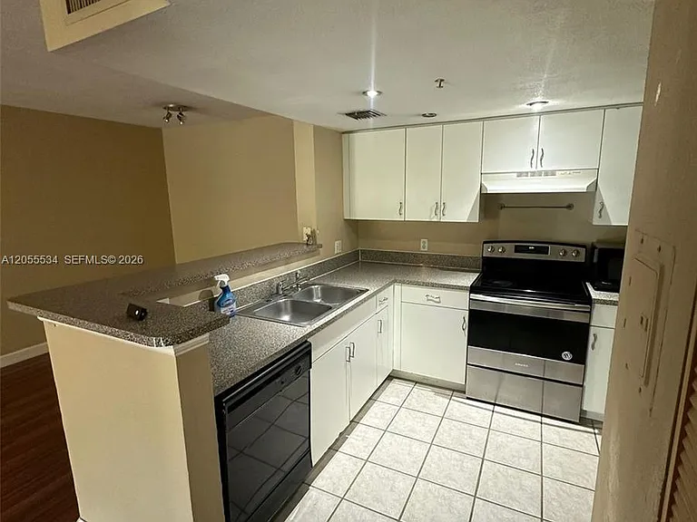 5035 Wiles Rd #203 — Photo 19