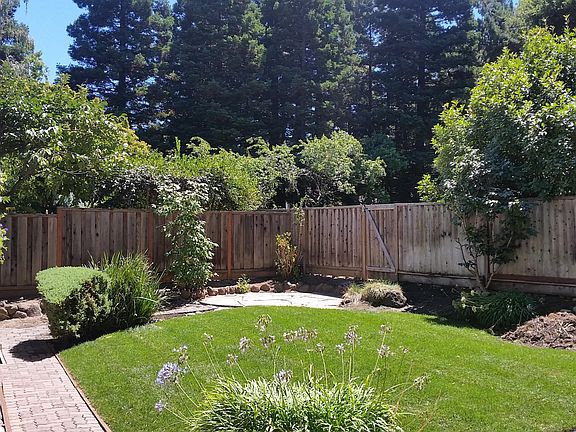 Backyard with gate to private community park

