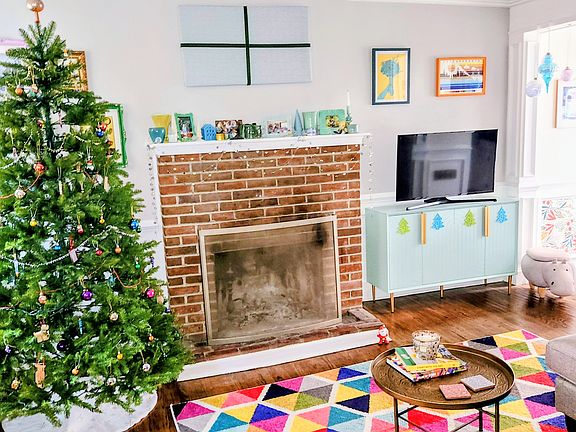 Living room with wood burning fireplace