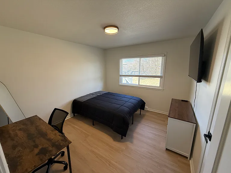 Full size bed w/ linens, desk, dresser, stand up mirror, night stand and smart TV in each room
