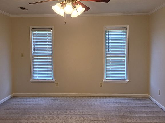 Bedroom #1 features ceiling fan and walk-in closet