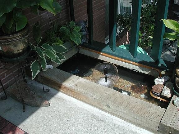 Koi pond w/fountain at front entrance