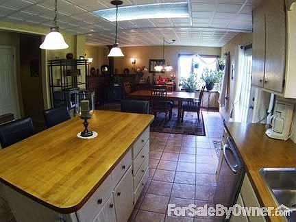 Kitchen
						:
						View of dining area with large corner windows