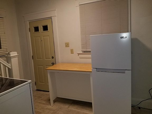 There is plenty of cabinet space for storage on the other side of the kitchen and a pull down faucet