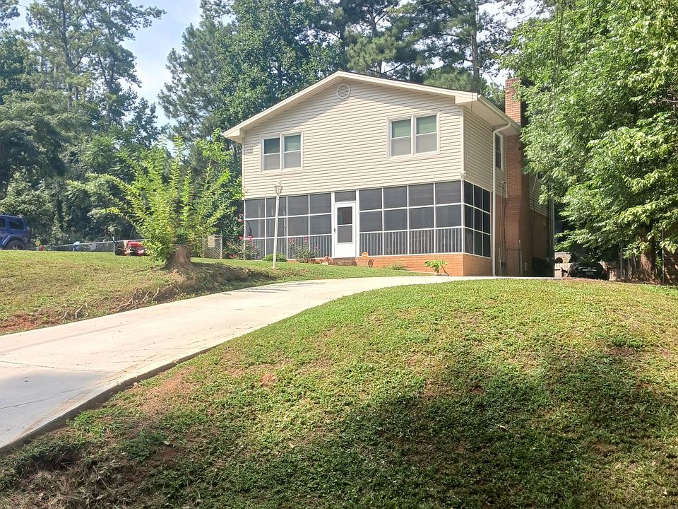 Front of duplex + renter's driveway