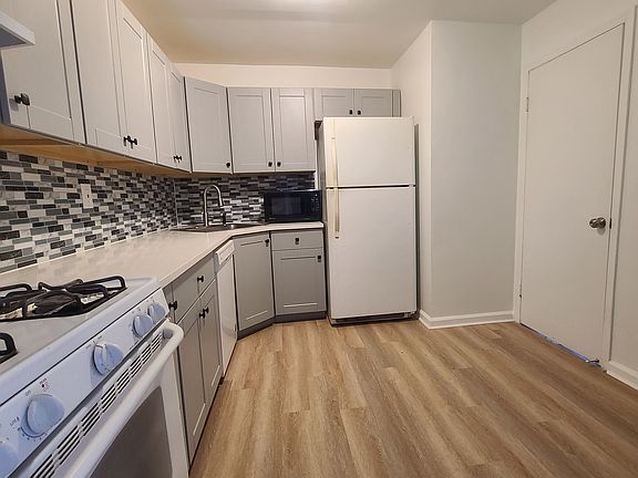 Brand new kitchen cabinets, stone countertop, flooring; with all appliances including dishwasher and microwave