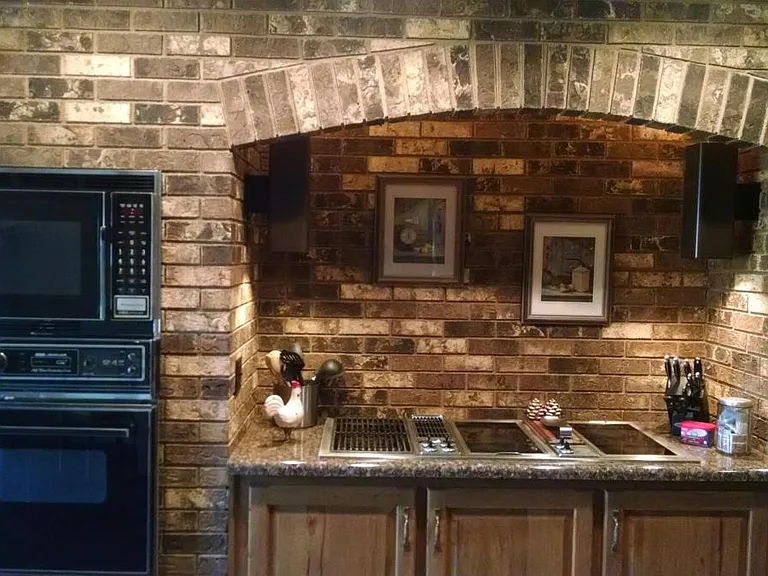 Beautiful Old-world kitchen. Jenn-Air cooktop and grill top. Ovens and dishwasher have been upgraded to stainless steel since this picture was taken.