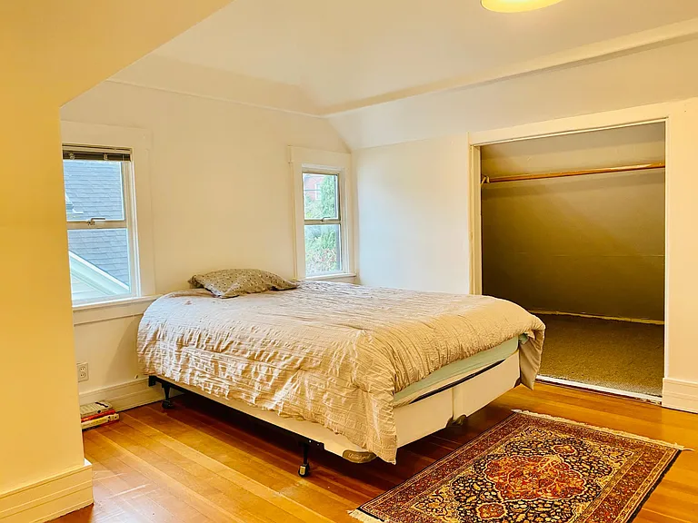 large bedroom with douglas fir flooring