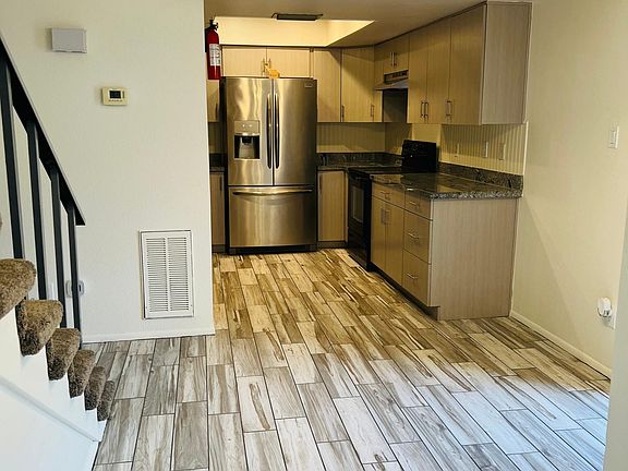 Dining Room/Kitchen-facing into area from living room. Patio access-bright and open!