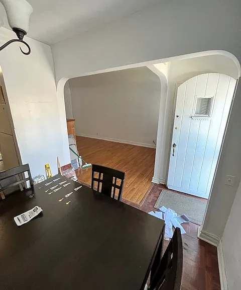 DINING ROOM WITH FRONT DOOR ON RIGHT AND LIVING ROOM JUST TO THE LEFT