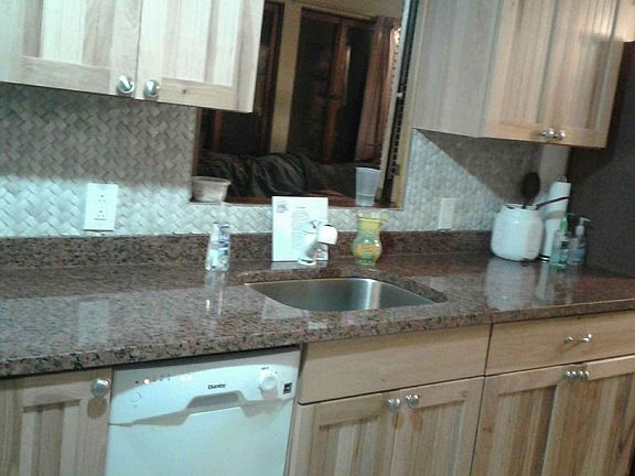 Granite counter tops and beautiful hickory cabinets.