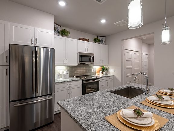 French Door Refrigerators, Flat Surface Stovetops, and Two Color Schemes to Choose from