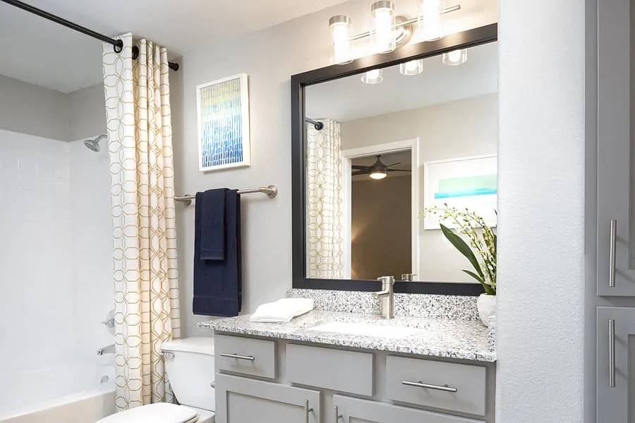 Contemporary bathrooms with framed mirrors