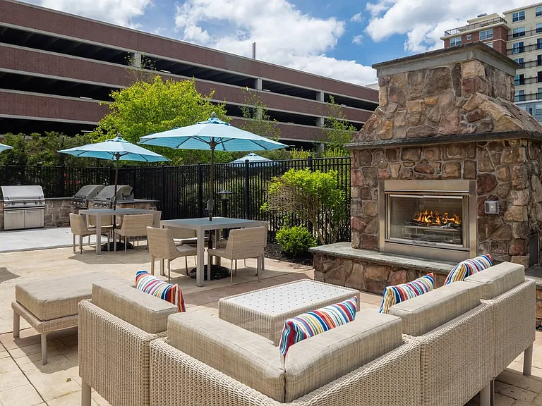 Grill area with lounge seating and fireplace