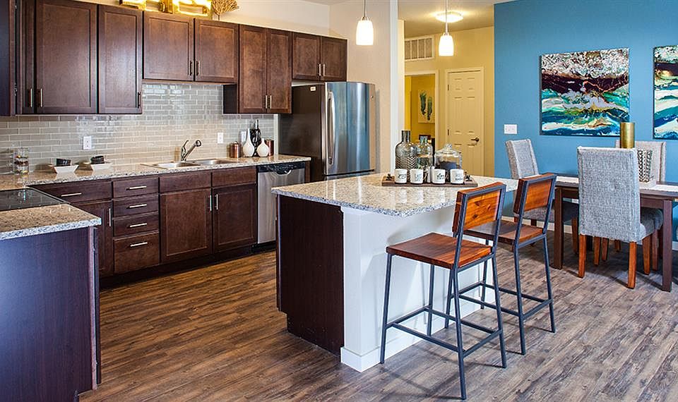 Granite countertops and tile backsplash