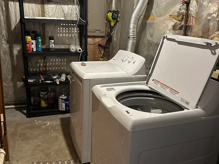 Full sized washer and dryer in separate laundry room
