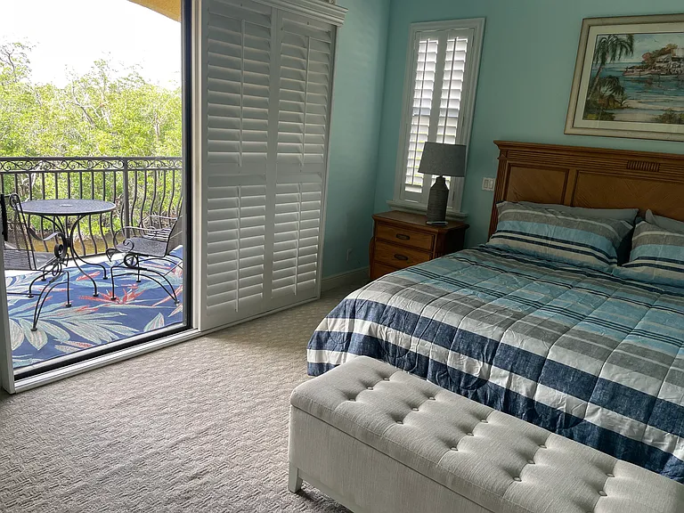 Master bedroom with private balcony.