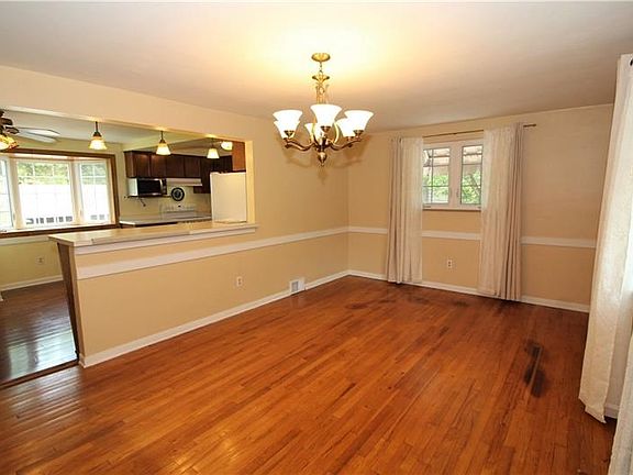 Open & Spacious 17x12 Dining Room w/ Gorgeous Hardwood Floors, Beautiful Bay Window, Chair Rail Trim & Opens into Massive Eat-in