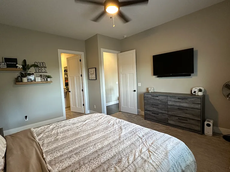 Master bedroom king-size bed shown
