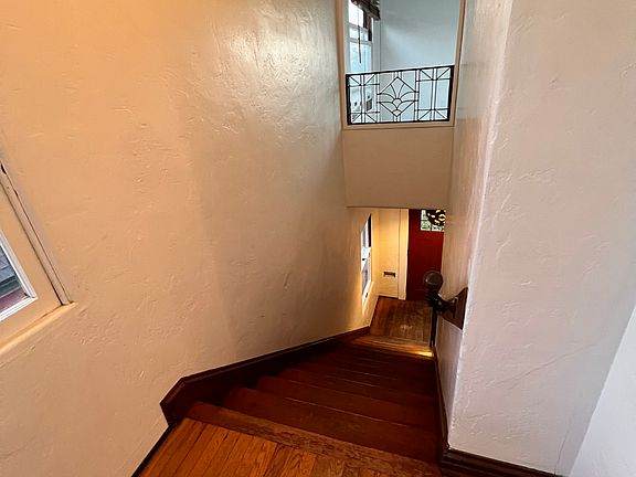 view of front door from second floor landing